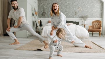 A joyful family engaging in morning stretches together, fostering a fun and healthy routine.